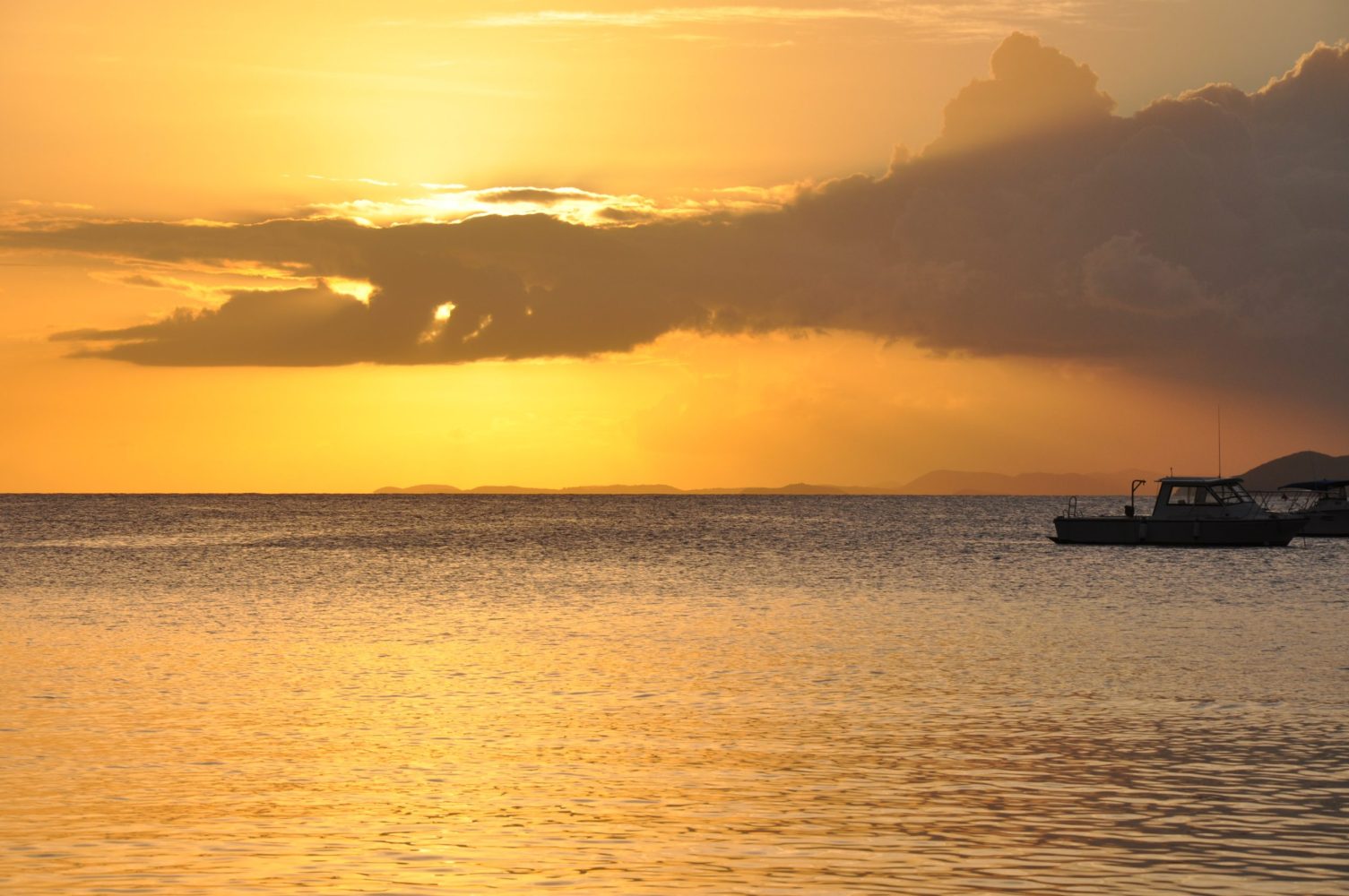 a sunset over a body of water