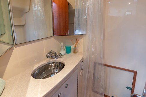 a kitchen with a sink and a mirror
