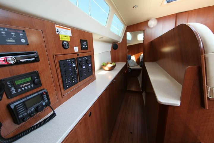 a kitchen with wooden cabinets and a table