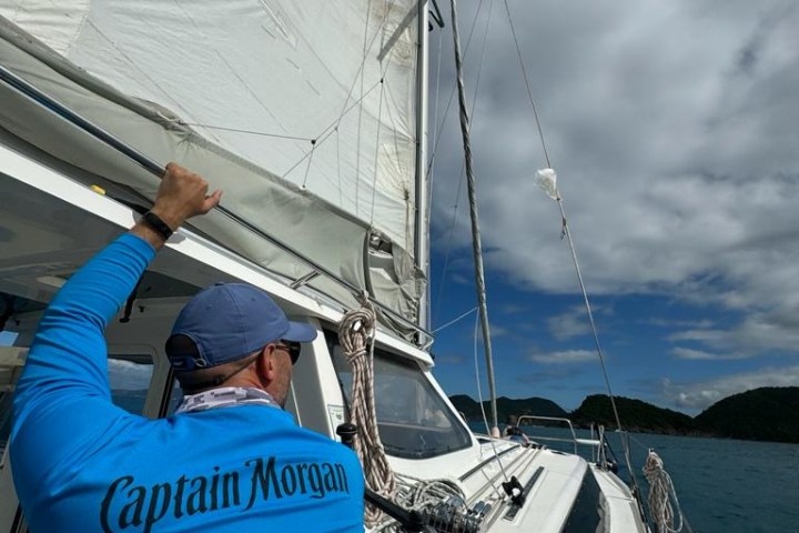 a person standing next to a boat