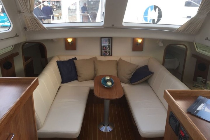 a room with a couch and a table in front of a window