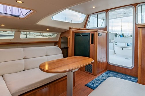 a room filled with furniture and a large window