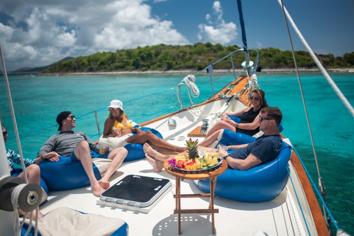 a group of people in a boat on a body of water